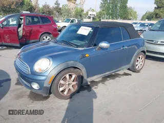 2010 MINI Convertible with VIN WMWMR3C56ATU98301, listed as a IAAI auction lot 42228835 with 117,325 mi miles and . Bid and sale history available at DreamBid. Image 2.