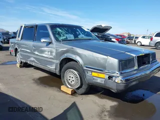 1991 Chrysler New Yorker z VIN 1C3XY66R2MD228813, wystawiony jako IAAI lot #42257734 z przebiegiem 45 786 mil mil oraz . Historia ofert i sprzedaży dostępna na DreamBid. Obrazek 1.