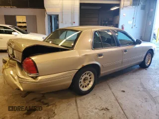 2000 Ford Crown Victoria LX z VIN 2FAFP74WXYX116130, wystawiony jako Copart lot #79441204 z przebiegiem 128 133 mil mil oraz Szkoda całkowita • Salvage title. Historia ofert i sprzedaży dostępna na DreamBid. Obrazek 3.