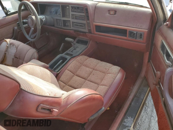 1985 Jeep Cherokee с VIN 1JCWB7742FT144063, выставлен на аукционе Copart как лот 84050844 с пробегом 80 072 миль миль и Чистый • Clean title. История ставок и продаж доступна на DreamBid. Изображение 8.