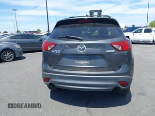 2014 Mazda CX-5 Grand Touring with VIN JM3KE4DY8E0391317, listed as a IAAI auction lot 41871641 with 77,048 mi miles. Bid and sale history available at carsss.com. Image 16.
