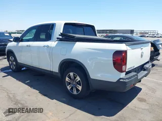 2019 Honda Ridgeline RTL-E with VIN 5FPYK3F74KB009279, listed as a IAAI auction lot 42348773 with 98,141 mi miles and . Bid and sale history available at DreamBid. Image 3.