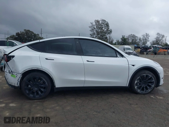 2023 Tesla Model Y Long Range with VIN 7SAYGDEE1PA106057, listed as a IAAI auction lot 41778642 with 1 mi miles. Bid and sale history available at carsss.com. Image 14.