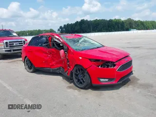 2016 Ford Focus SE z VIN 1FADP3F25GL314507, wystawiony jako IAAI lot #42835594 z przebiegiem 71 509 mil mil oraz . Historia ofert i sprzedaży dostępna na DreamBid. Obrazek 1.