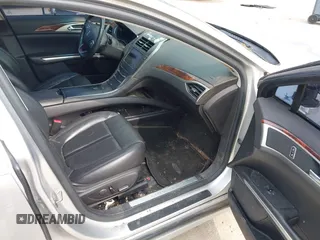 2013 Lincoln MKZ z VIN 3LN6L2G95DR828063, wystawiony jako IAAI lot #42398124 z przebiegiem 158 626 mil mil oraz . Historia ofert i sprzedaży dostępna na DreamBid. Obrazek 5.