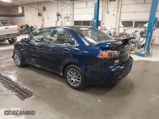 2013 Mitsubishi Lancer SE with VIN JA32V2FW9DU005616, listed as a IAAI auction lot 41247087 with 129,055 mi miles. Bid and sale history available at carsss.com. Image 3.