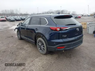 2021 Mazda CX-9 Touring z VIN JM3TCBCY4M0520362, wystawiony jako IAAI lot #41193396 z przebiegiem 17 323 mil mil oraz . Historia ofert i sprzedaży dostępna na DreamBid. Obrazek 3.