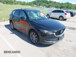 2019 Mazda CX-5 Grand Touring with VIN JM3KFADM2K1549794, listed as a IAAI auction lot 42351906 with 78,671 mi miles and . Bid and sale history available at DreamBid. Image 1.