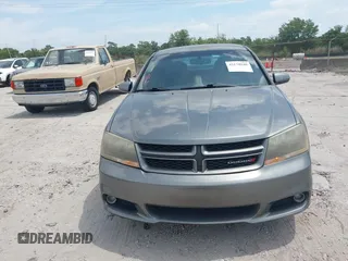 2013 Dodge Avenger R/T with VIN 1C3CDZBG4DN590183, listed as a IAAI auction lot 42178040 with 150,265 mi miles and . Bid and sale history available at carsss.com. Image 6.