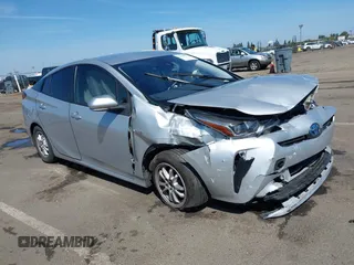 2021 Toyota Prius L Eco with VIN JTDKAMFUXM3144991, listed as a IAAI auction lot 42147025 with 106,466 mi miles and . Bid and sale history available at DreamBid. Image 1.