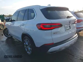 2021 BMW X5 sDrive40i with VIN 5UXCR4C07M9F23816, listed as a IAAI auction lot 41871364 with 55,401 mi miles. Bid and sale history available at carsss.com. Image 3.