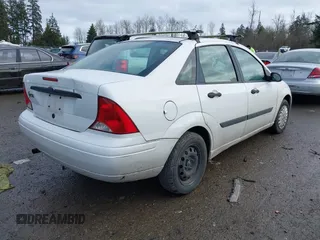 2003 Ford Focus LX with VIN 1FAFP33P73W156382, listed as a IAAI auction lot 41591885 with 174,169 mi miles and . Bid and sale history available at carsss.com. Image 4.