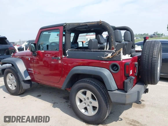2013 Jeep Wrangler Sport z VIN 1C4GJWAG0DL543850, wystawiony jako IAAI lot #42374916 z przebiegiem 163 977 mil mil oraz . Historia ofert i sprzedaży dostępna na DreamBid. Obrazek 14.