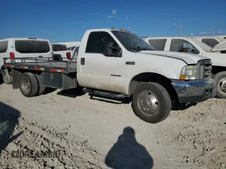 2001 Ford F-450 XL with VIN 1FDXF46F11EA30091, listed as a Copart auction lot 77682024 with 155,351 mi miles and Salvage Title. Bid and sale history available at carsss.com. Image 4.