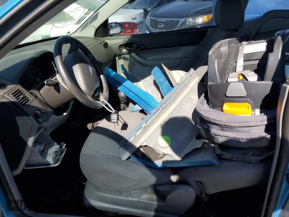 2007 Ford Focus S z VIN 1FAFP31N77W244856, wystawiony jako Copart lot #88972705 z przebiegiem Nie podano mil oraz Szkoda całkowita • Salvage title. Historia ofert i sprzedaży dostępna na DreamBid. Obrazek 7.