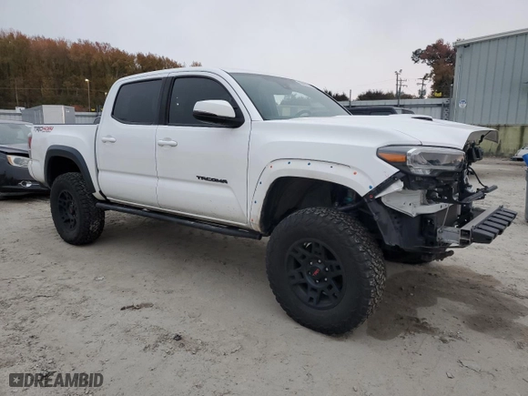 2020 Toyota Tacoma 4WD SR5 with VIN 5TFCZ5AN1LX218079, listed as a Copart auction lot 80085974 with 65,634 mi miles and Salvage Title. Bid and sale history available at carsss.com. Image 4.