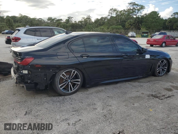 2022 BMW 7 Series 750i xDrive with VIN WBA7U2C01NCK83702, listed as a Copart auction lot 74327704 with Not provided miles and Salvage title. Bid and sale history available at DreamBid. Image 3.