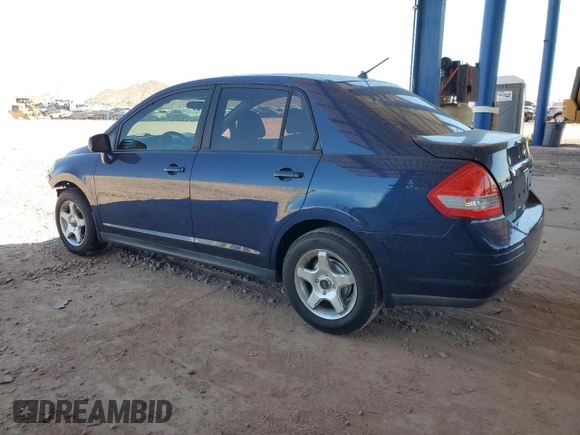 2009 Nissan Versa S z VIN 3N1BC11E89L399629, wystawiony jako Copart lot #57353335 z przebiegiem 169 245 mil mil oraz Szkoda całkowita • Salvage title. Historia ofert i sprzedaży dostępna na DreamBid. Obrazek 2.