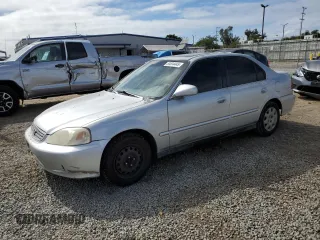 1999 Honda Civic EX z VIN 1HGEJ8649XL023265, wystawiony jako Copart lot #53534445 z przebiegiem 265 017 mil mil oraz Czysty tytuł • Clean title. Historia ofert i sprzedaży dostępna na DreamBid. Obrazek 1.