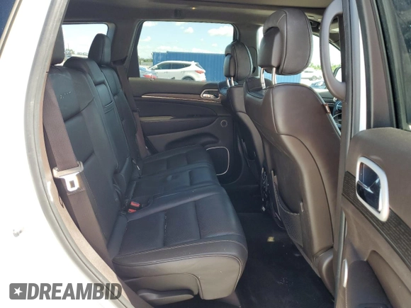 2018 Jeep Grand Cherokee Summit с VIN 1C4RJEJG7JC228316, выставлен на аукционе Copart как лот 57062435 с пробегом 99 442 миль миль и Списание • Salvage title. История ставок и продаж доступна на DreamBid. Изображение 11.