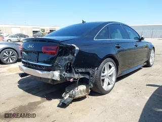 2016 Audi S6 Prestige with VIN WAUH2AFC6GN130251, listed as a IAAI auction lot 41912382 with 72,512 mi miles. Bid and sale history available at carsss.com. Image 4.