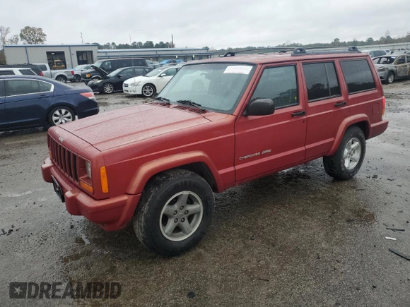 1999 Jeep Cherokee Sport with VIN 1J4FT68S1XL601799, listed as a Copart auction lot 83881844 with 203,572 mi miles and Salvage title. Bid and sale history available at DreamBid. Image 1.