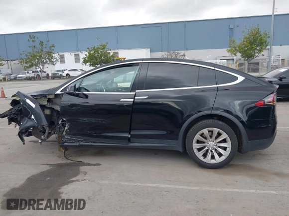 2017 Tesla Model X 90D with VIN 5YJXCAE2XHF075341, listed as a IAAI auction lot 41784008 with 77,439 mi miles and . Bid and sale history available at DreamBid. Image 15.