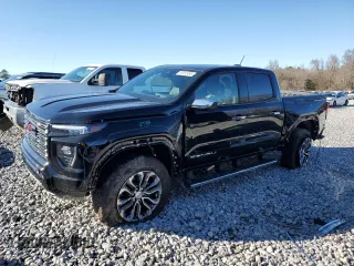 2024 GMC Canyon 4WD Denali with VIN 1GTP6FEK2R1190966, listed as a Copart auction lot 87812495 with 2,143 mi miles and Salvage Title. Bid and sale history available at carsss.com. Image 1.