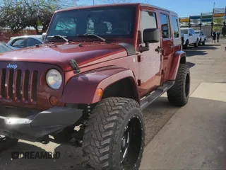 2010 Jeep Wrangler Unlimited Sahara with VIN 1J4BA5H10AL117474, listed as a IAAI auction lot 41969202 with 131,256 mi miles. Bid and sale history available at carsss.com. Image 2.