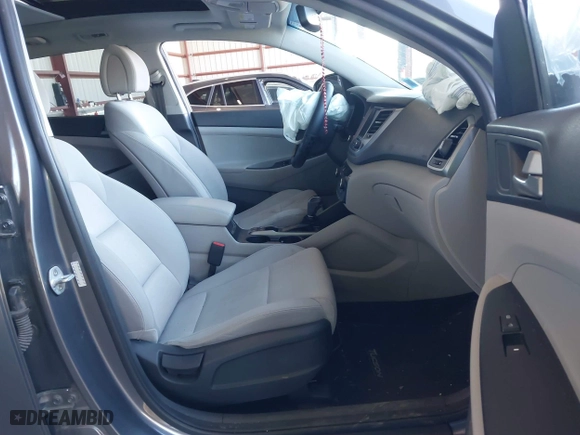 2018 Hyundai Tucson Value with VIN KM8J3CA20JU762120, listed as a IAAI auction lot 41878796 with 103,346 mi miles. Bid and sale history available at carsss.com. Image 5.