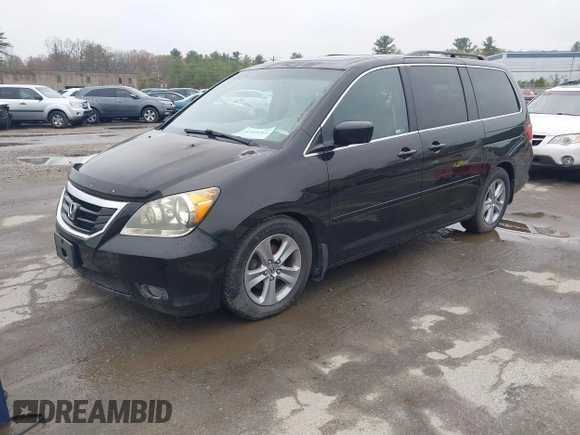 2010 Honda Odyssey Touring with VIN 5FNRL3H97AB056975, listed as a IAAI auction lot 42169269 with 183,483 mi miles. Bid and sale history available at carsss.com. Image 2.