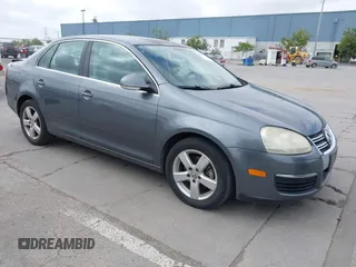 2009 Volkswagen Jetta Sedan SE with VIN 3VWRZ71K49M084983, listed as a IAAI auction lot 42095707 with 154,691 mi miles. Bid and sale history available at carsss.com. Image 1.