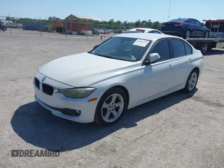 2014 BMW 3 Series 320i with VIN WBA3B1G53ENT00444, listed as a IAAI auction lot 42082984 with 94,401 mi miles. Bid and sale history available at carsss.com. Image 2.