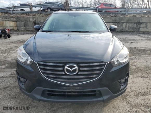 2016 Mazda CX-5 Touring with VIN JM3KE4CY7G0860868, listed as a Copart auction lot 51203415 with 86,768 mi miles and Salvage Title. Bid and sale history available at carsss.com. Image 5.