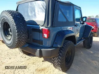 2015 Jeep Wrangler Sport with VIN 1C4AJWAG0FL591213, listed as a IAAI auction lot 41893306 with 107,807 mi miles and . Bid and sale history available at DreamBid. Image 4.
