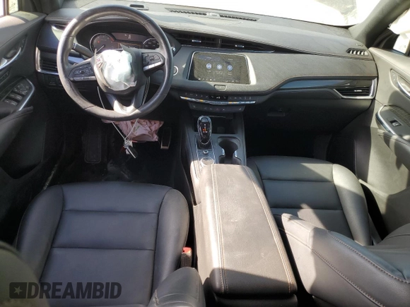 2023 Cadillac XT4 FWD Sport with VIN 1GYFZER47PF107311, listed as a Copart auction lot 87583565 with 26,585 mi miles and Salvage title. Bid and sale history available at DreamBid. Image 8.