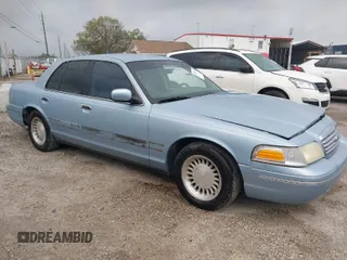 1999 Ford Crown Victoria z VIN 2FAFP73WXXX221069, wystawiony jako IAAI lot #41750127 z przebiegiem 177 142 mil mil oraz . Historia ofert i sprzedaży dostępna na DreamBid. Obrazek 1.