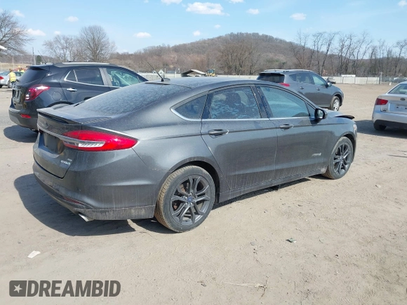 2018 Ford Fusion SE z VIN 3FA6P0LU6JR118226, wystawiony jako IAAI lot #41811406 z przebiegiem 165 352 mil mil oraz . Historia ofert i sprzedaży dostępna na DreamBid. Obrazek 4.
