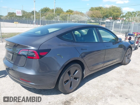 2023 Tesla Model 3 with VIN 5YJ3E1EA8PF626235, listed as a IAAI auction lot 42022893 with 30,333 mi miles and . Bid and sale history available at DreamBid. Image 4.