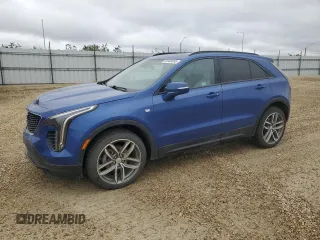 2023 Cadillac XT4 AWD Sport z VIN 1GYFZFR47PF153453, wystawiony jako Copart lot #56988695 z przebiegiem 67 533 mil mil oraz Szkody całkowita. Historia ofert i sprzedaży dostępna na DreamBid. Obrazek 1.