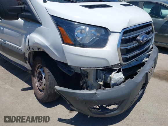 2020 Ford Transit Cargo z VIN 1FTBW3X89LKB72069, wystawiony jako IAAI lot #42623407 z przebiegiem 454 279 mil mil oraz . Historia ofert i sprzedaży dostępna na DreamBid. Obrazek 6.