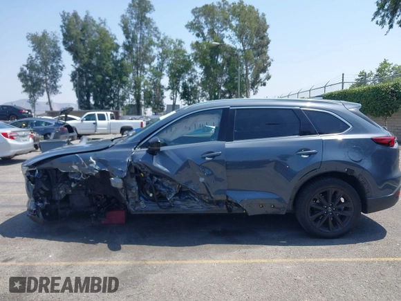 2022 Mazda CX-9 Grand Touring with VIN JM3TCBDY1N0611766, listed as a IAAI auction lot 42452059 with 60,755 mi miles and . Bid and sale history available at DreamBid. Image 14.