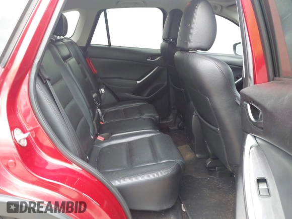 2016 Mazda CX-5 Grand Touring z VIN JM3KE2DY6G0693678, wystawiony jako IAAI lot #42443247 z przebiegiem 127 620 mil mil oraz . Historia ofert i sprzedaży dostępna na DreamBid. Obrazek 8.