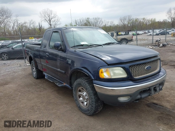 2002 Ford F-150 XL with VIN 2FTPX18L32CA67220, listed as a IAAI auction lot 42077154 with 233,409 mi miles. Bid and sale history available at carsss.com. Image 1.