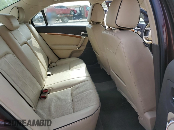 2011 Lincoln MKZ with VIN 3LNHL2JC0BR766629, listed as a Copart auction lot 56338015 with 118,728 mi miles and Salvage title. Bid and sale history available at DreamBid. Image 10.