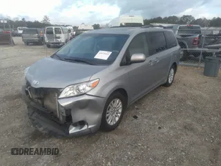 2014 Toyota Sienna XLE with VIN 5TDYK3DC0ES421501, listed as a IAAI auction lot 41672414 with 111,911 mi miles. Bid and sale history available at carsss.com. Image 2.