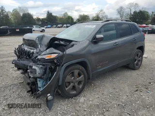 2016 Jeep Cherokee 75th Anniversary with VIN 1C4PJLCB7GW258663, listed as a Copart auction lot 52451255 with 140,865 mi miles and Salvage Title. Bid and sale history available at carsss.com. Image 1.