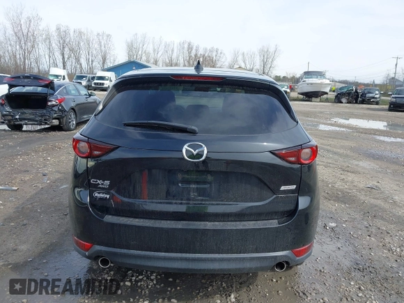 2018 Mazda CX-5 Touring with VIN JM3KFBCMXJ0438177, listed as a IAAI auction lot 42152275 with 65,434 mi miles and . Bid and sale history available at carsss.com. Image 16.