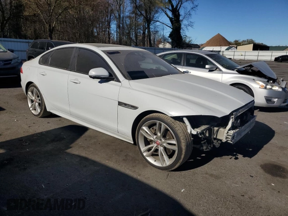 2017 Jaguar XF with VIN SAJBL4BV8HCY34982, listed as a Copart auction lot 79397414 with 96,672 mi miles and Salvage Title. Bid and sale history available at DreamBid. Image 4.