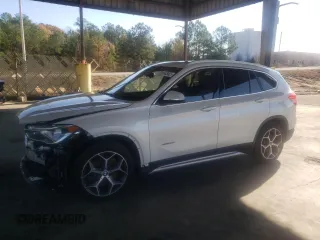2017 BMW X1 sDrive28i with VIN WBXHU7C31H5H37217, listed as a Copart auction lot 70114342 with 73,683 mi miles. Bid and sale history available at carsss.com. Image 1.
